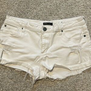 White distressed shorts